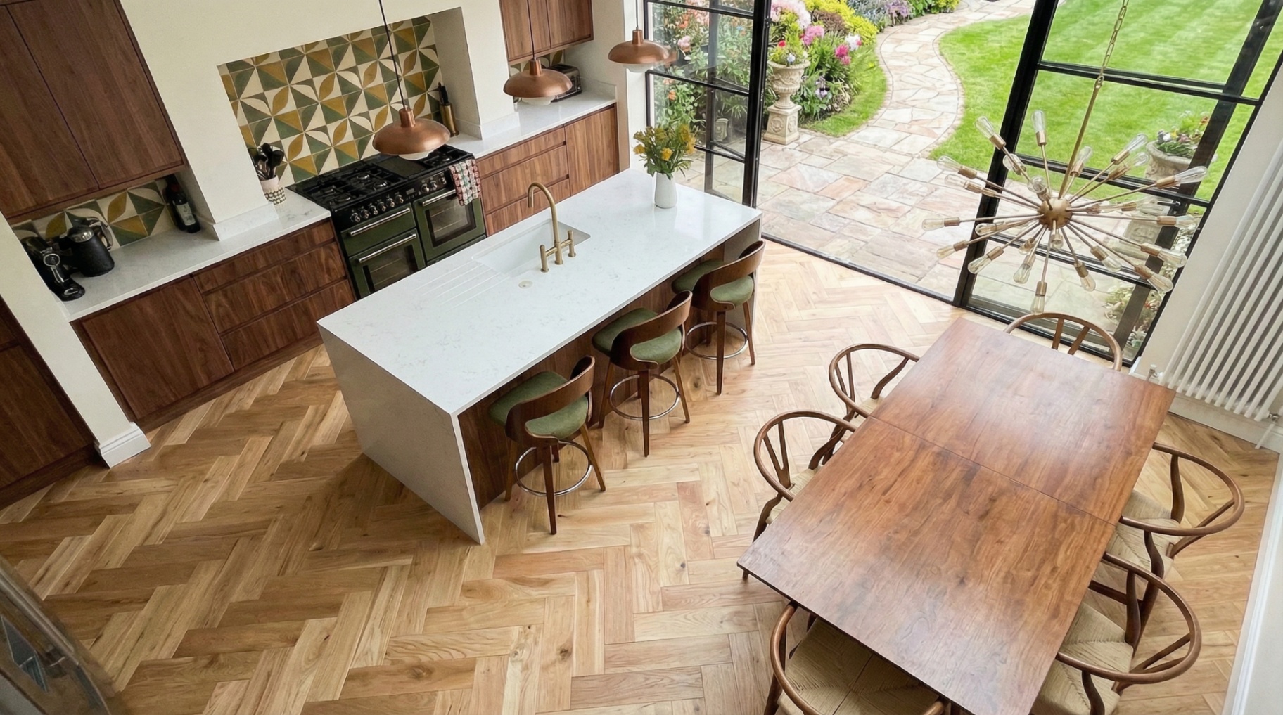 Open-plan kitchen diner with herringbone oak flooring